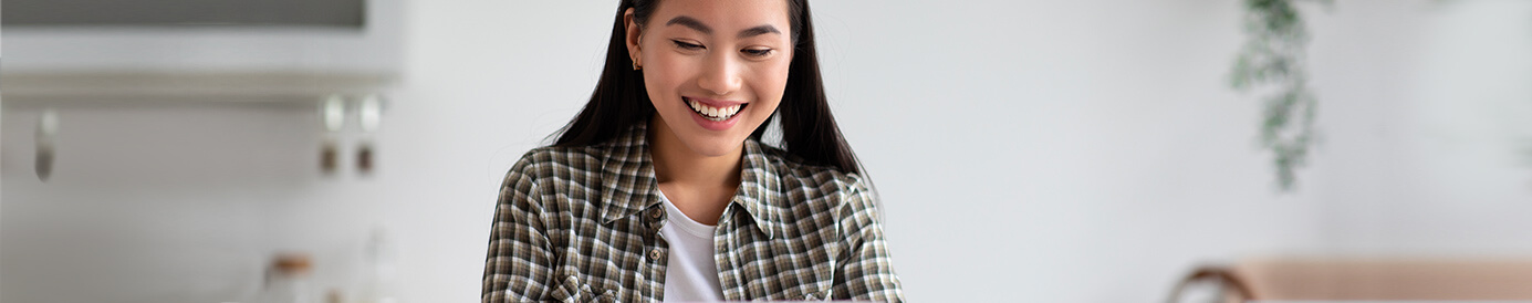 A woman reading over her credit card statement