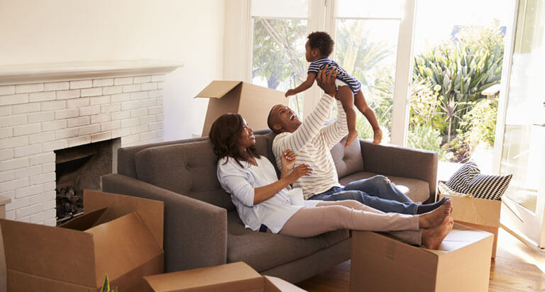 A family sitting in their new house